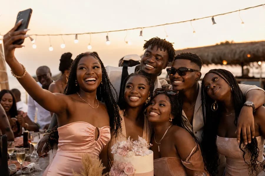 Ghanaian friends capturing a birthday toast